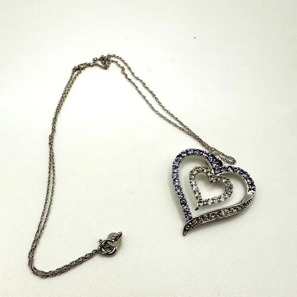 Genuine 1.5ctw tanzanite and‎ CZ accent heart necklace in sterling silver!